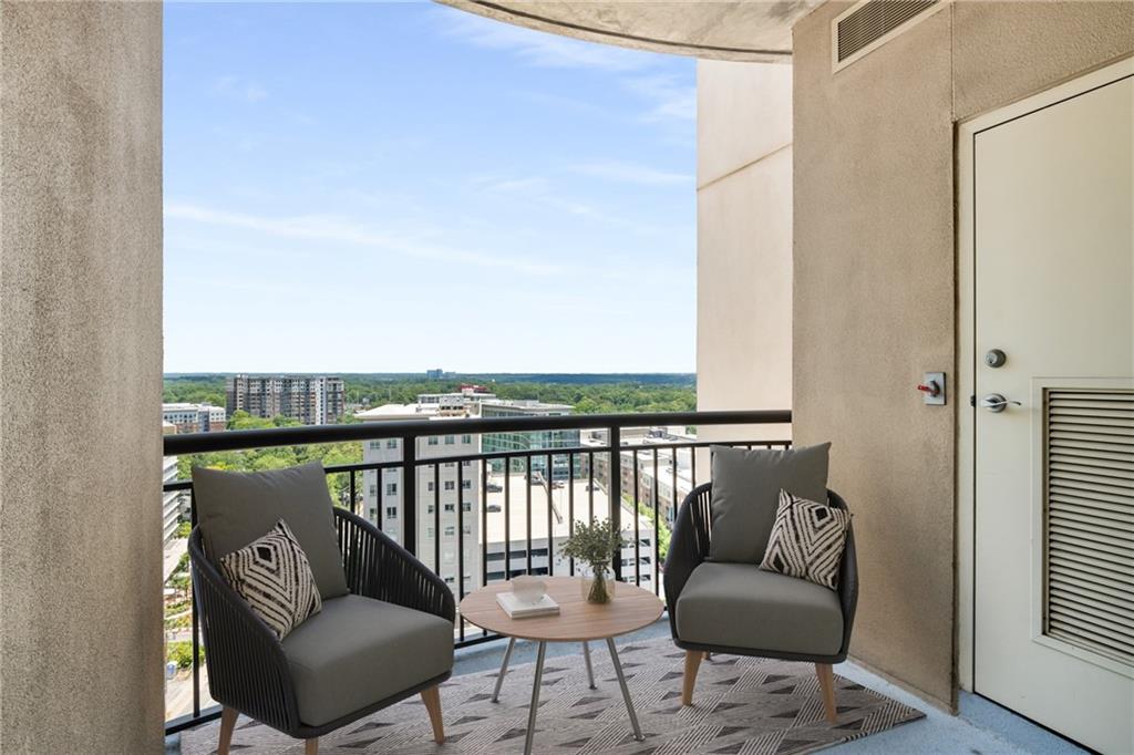 325 East Paces Ferry Road Northeast, Unit 1704 Atlanta, GA 30305 - Photo 7 of 29 a balcony with outdoor seating and plants