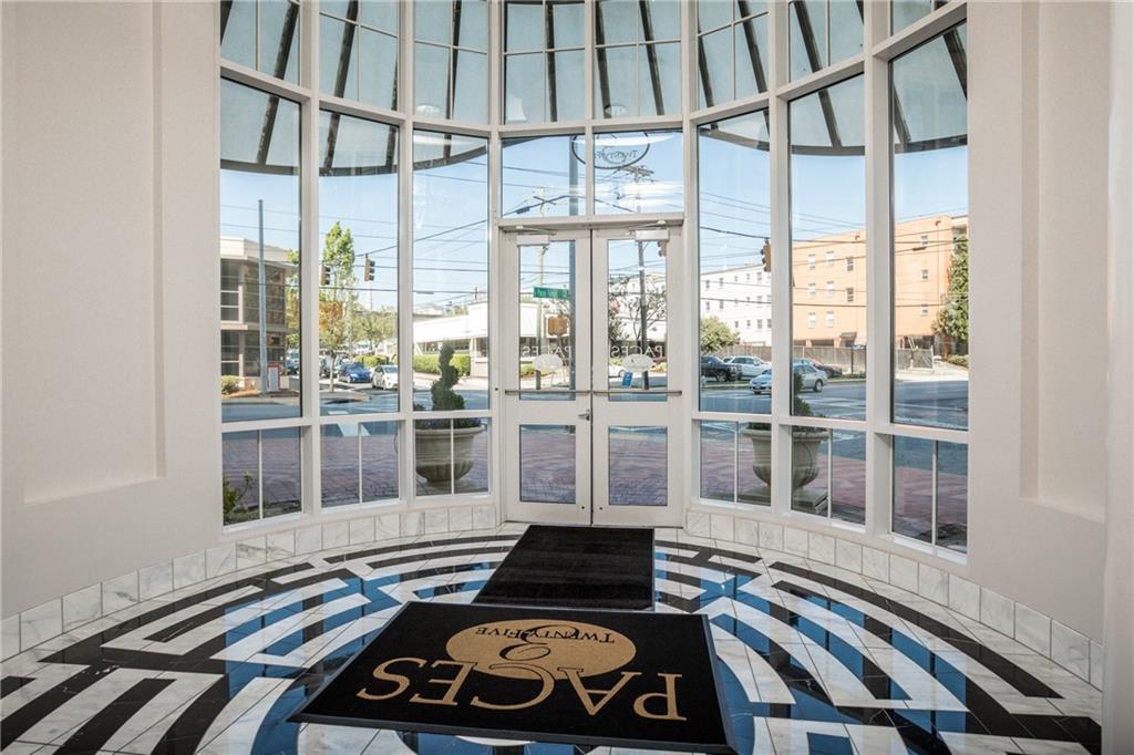 325 East Paces Ferry Road Northeast, Unit 1704 Atlanta, GA 30305 - Photo 10 of 29 a picture of a room with wooden floor and windows