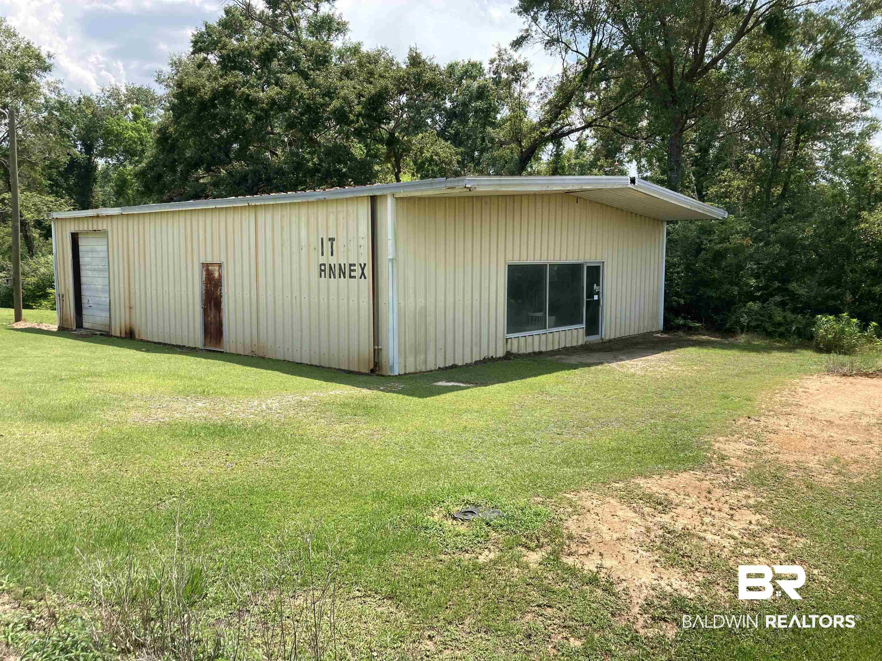 6151 Meadows Road Walnut Hill, FL 32568 - Photo 25 of 29 View of outdoor structure with a lawn