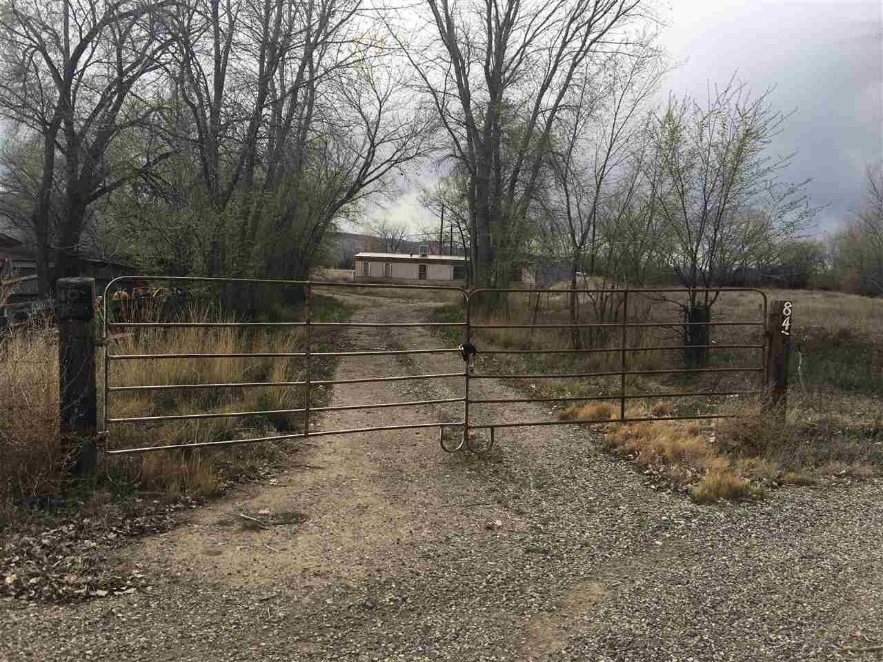 a view of wooden fence and trees
