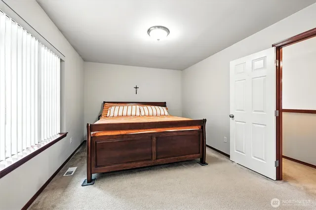 a room with a bed and a window