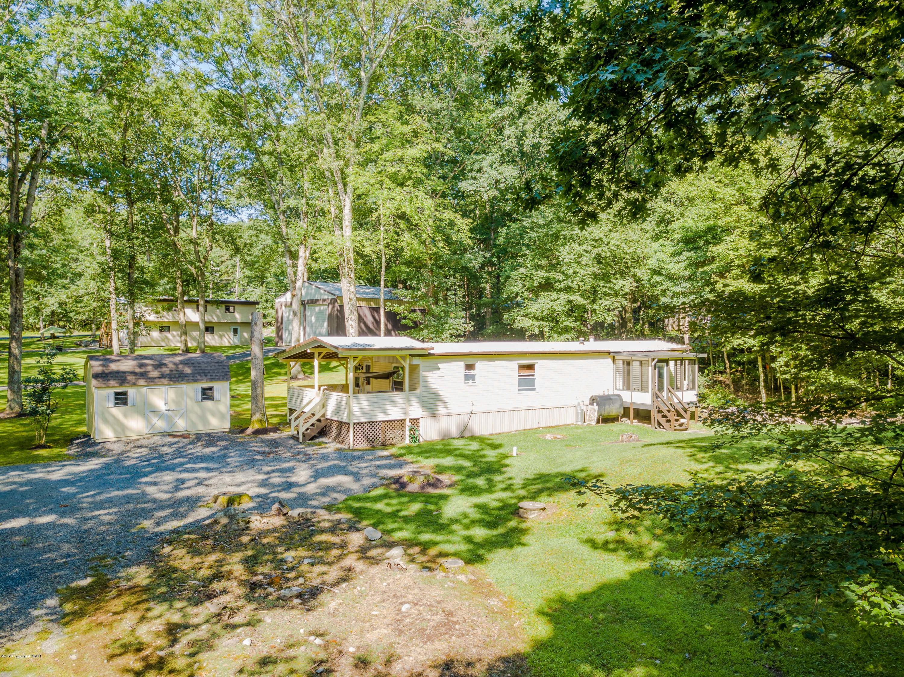 664 Cranberry Road East Stroudsburg, PA 18301 - Photo 5 of 14 a view of a house with a yard
