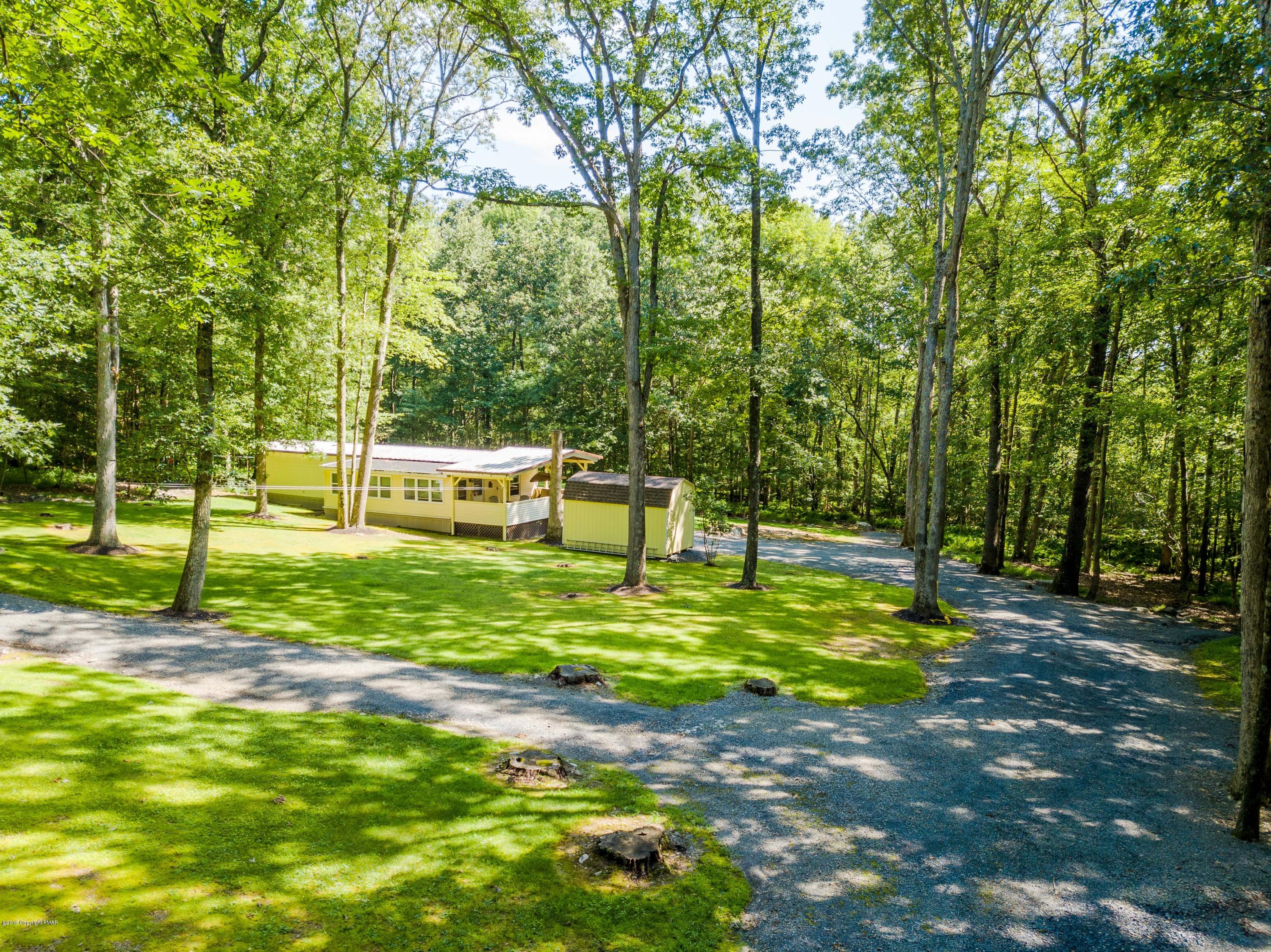 664 Cranberry Road East Stroudsburg, PA 18301 - Photo 8 of 14 a view of a yard with a tree