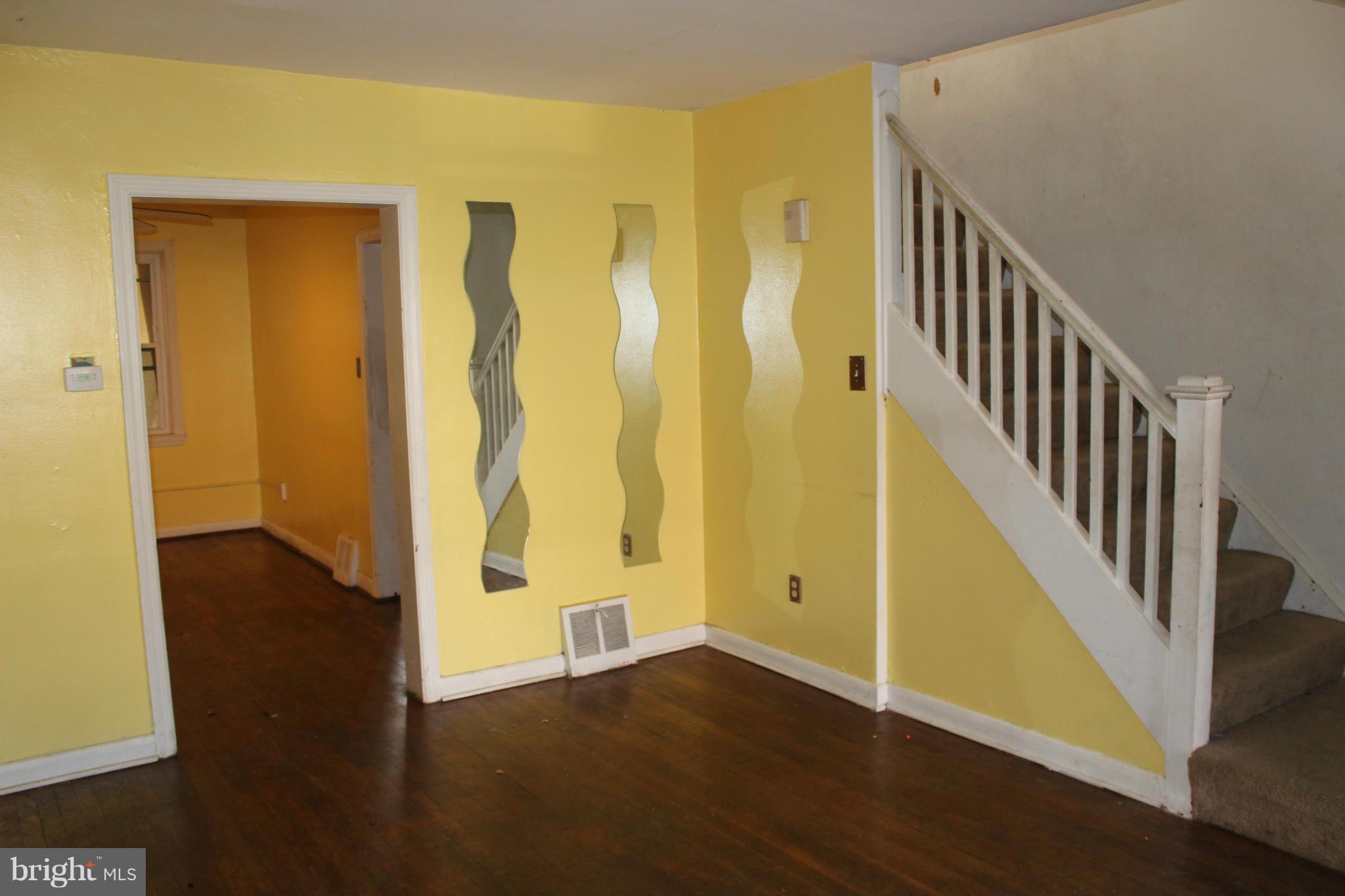 629 Roundview Road Baltimore, MD 21225 - Photo 2 of 26 a view of an entryway with wooden floor
