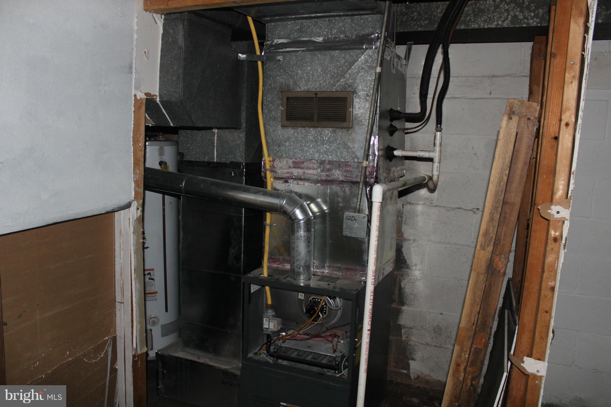 629 Roundview Road Baltimore, MD 21225 - Photo 13 of 26 a close view of water heater room