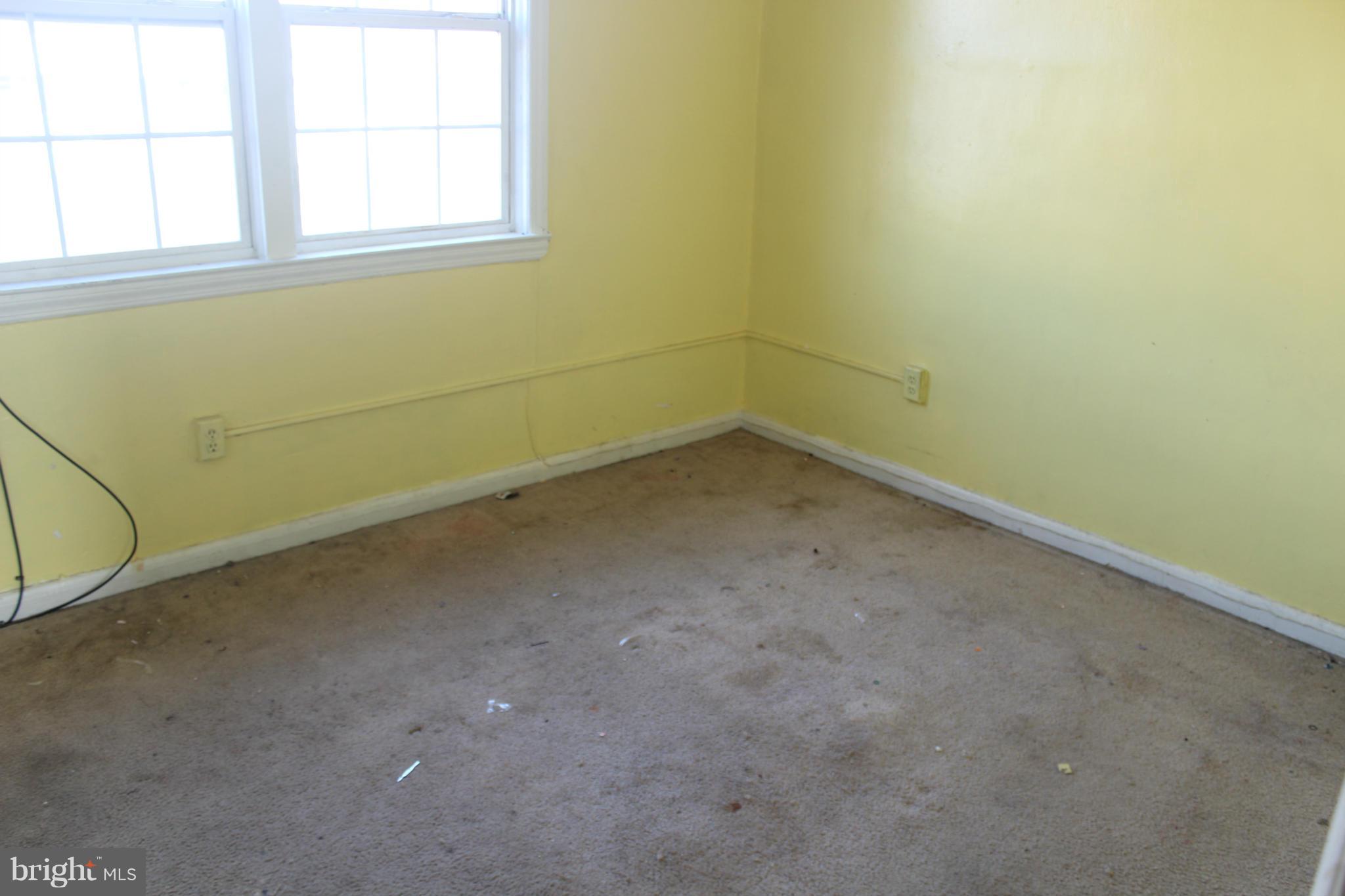 629 Roundview Road Baltimore, MD 21225 - Photo 16 of 26 an empty room with a window