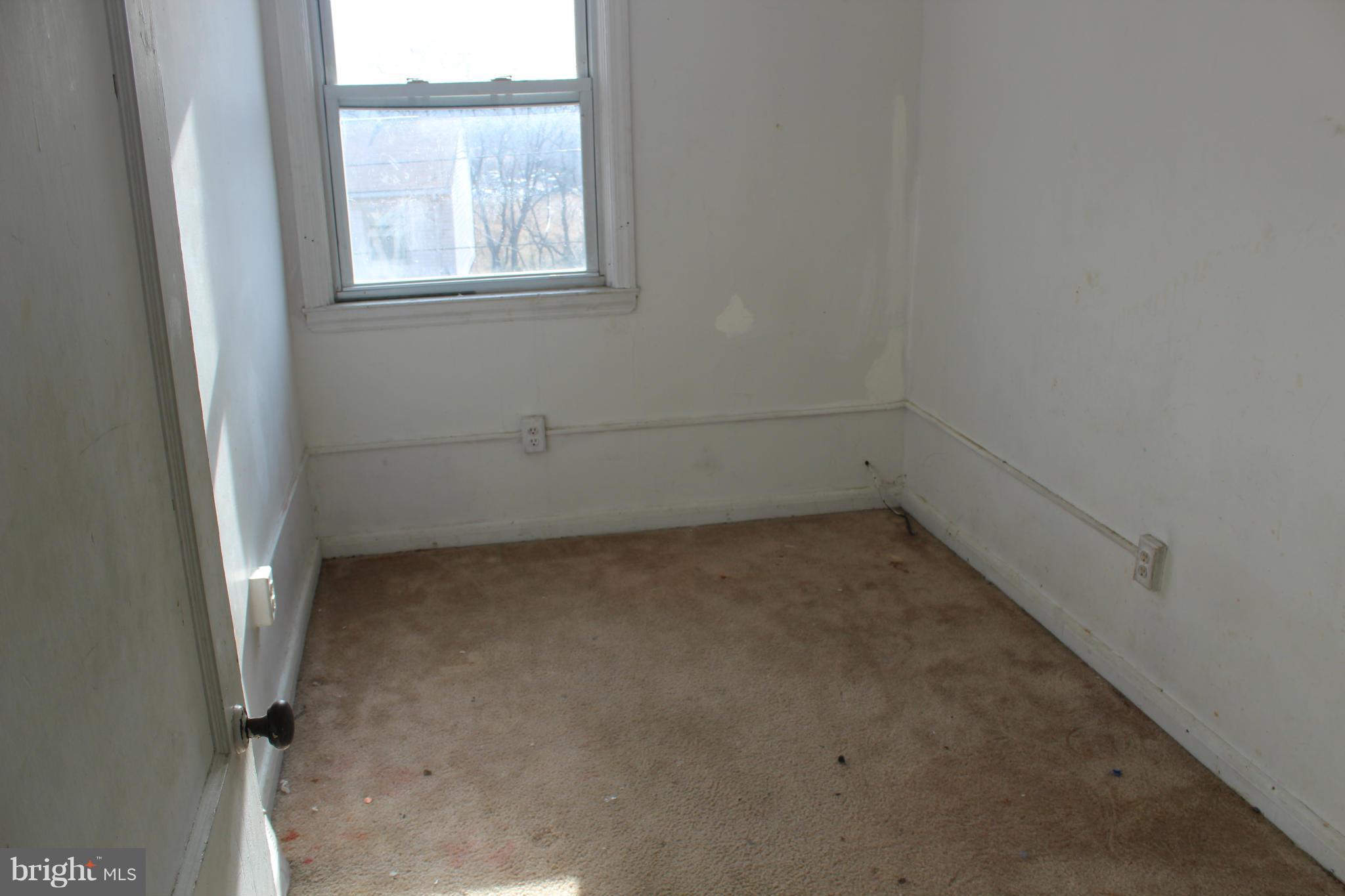 629 Roundview Road Baltimore, MD 21225 - Photo 17 of 26 an empty room with a window