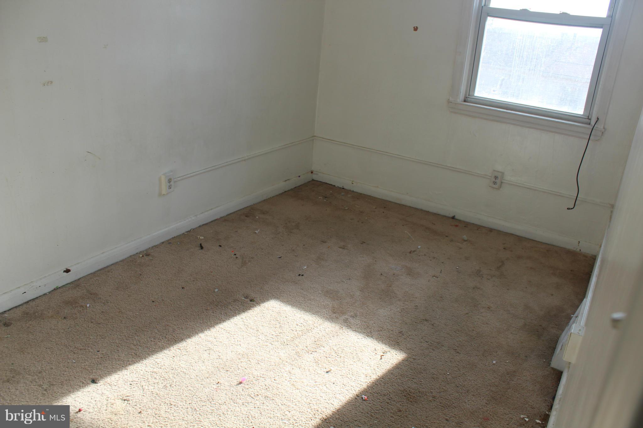 629 Roundview Road Baltimore, MD 21225 - Photo 18 of 26 an empty room with a window