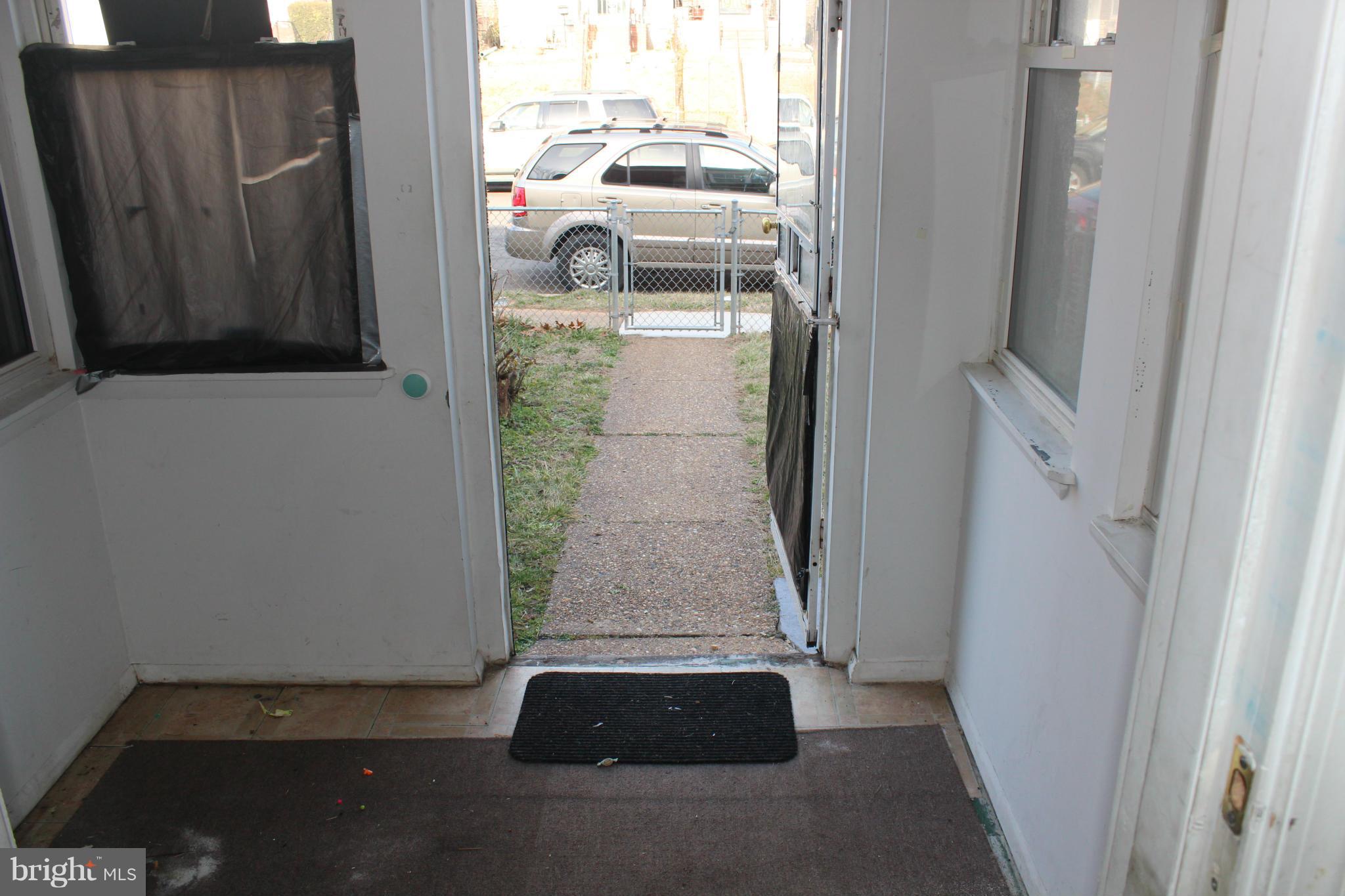 629 Roundview Road Baltimore, MD 21225 - Photo 3 of 26 a view of a car park from a corridor