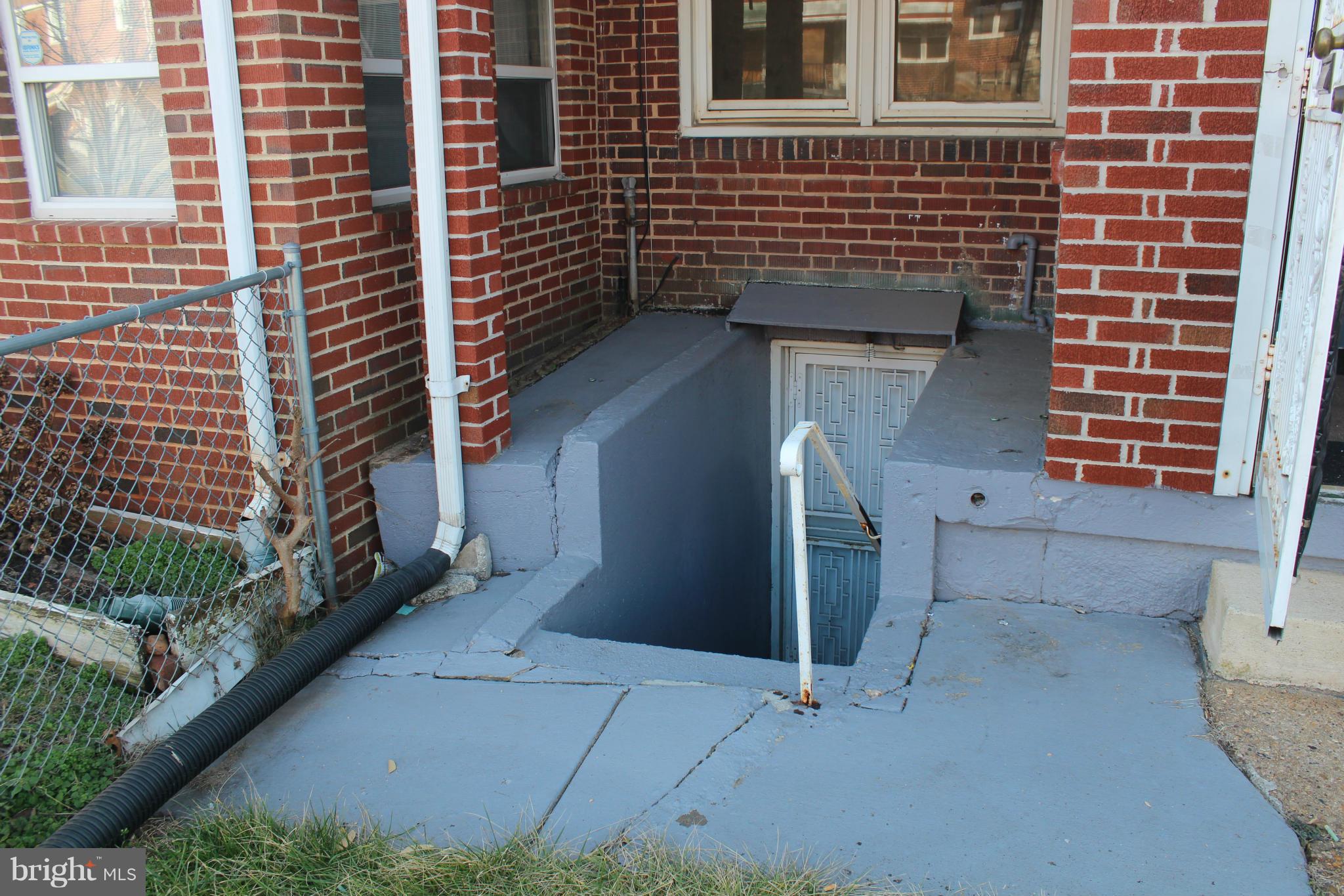 629 Roundview Road Baltimore, MD 21225 - Photo 23 of 26 a view of a door and brick wall