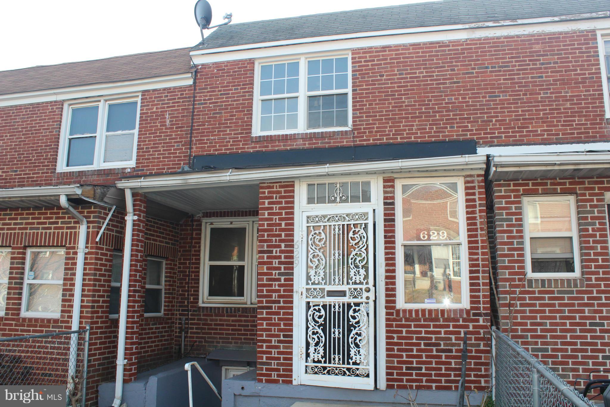 629 Roundview Road Baltimore, MD 21225 - Photo 26 of 26 a view of a brick building with large windows