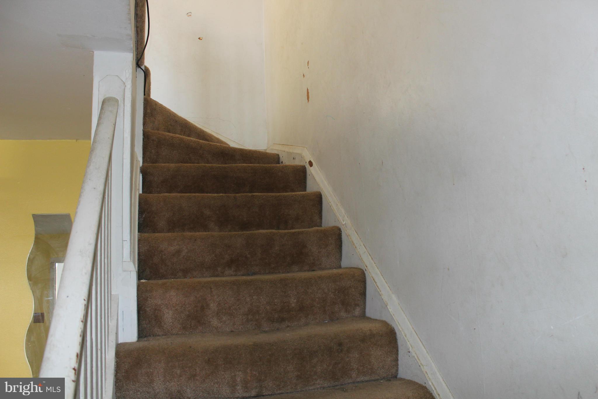 629 Roundview Road Baltimore, MD 21225 - Photo 4 of 26 a view of staircase with white walls