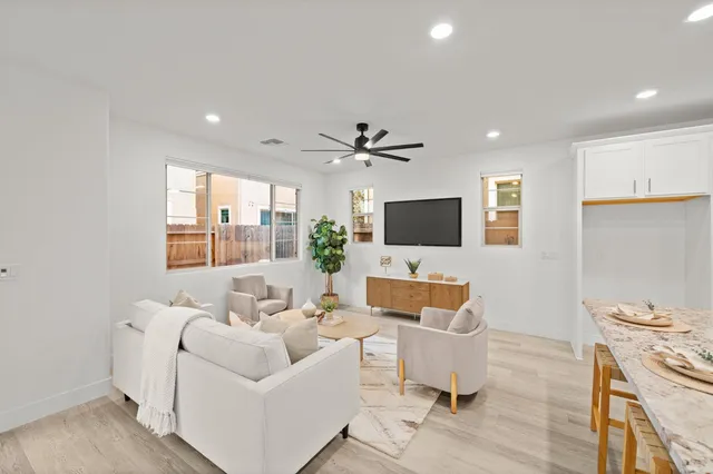 a dining room with furniture and wooden floor
