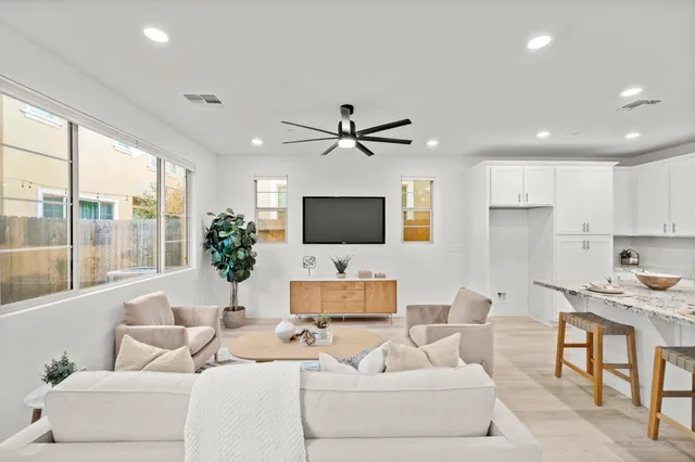 a dining room with furniture and window