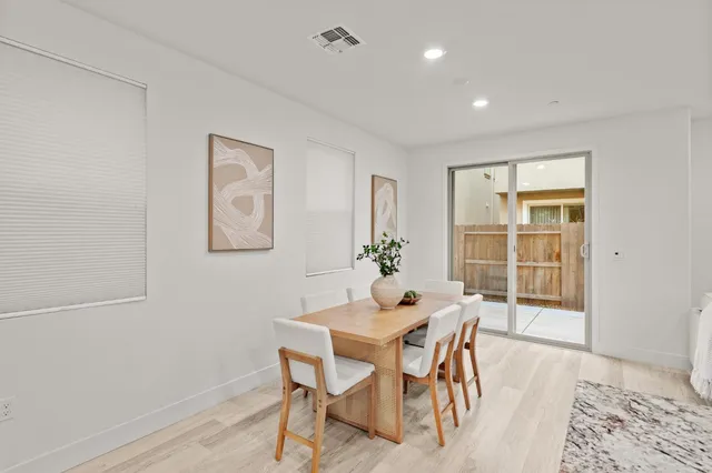 a view of a hallway with two rooms