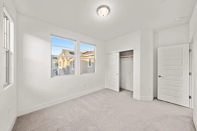 a backyard of a house with yard and furniture