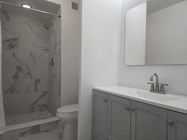 a bathroom with a sink and a toilet