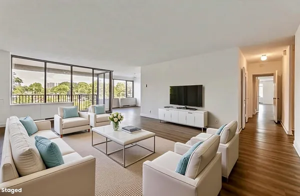 a view of a dining room with furniture window and wooden floor