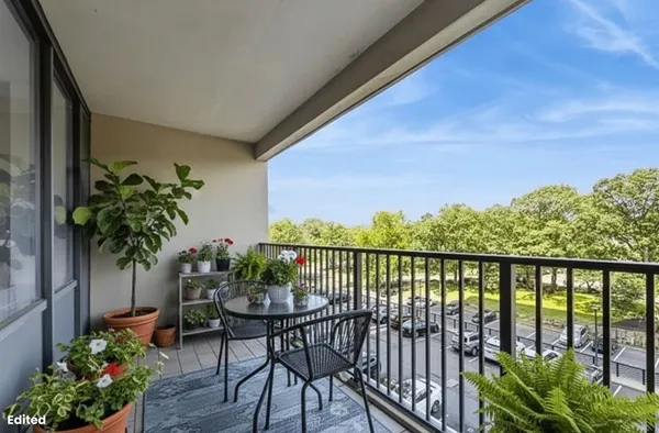 a kitchen with stainless steel appliances a stove top oven a sink and a refrigerator