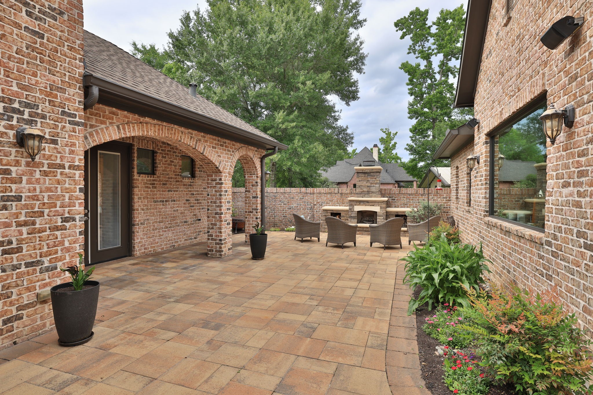 6918 Comanche Bend Montgomery, TX 77316 - Photo 14 of 50 The courtyard fireplace creates the perfect gathering spot for s’mores, your favorite morning coffee, or relaxing evening beverage. This private courtyard also offers an ideal play area for children and pets while creating a warm and inviting extension of the home’s entertaining space. The home additionally includes an automation system with distributed audio and visual features designed for comfortable everyday living and entertaining.