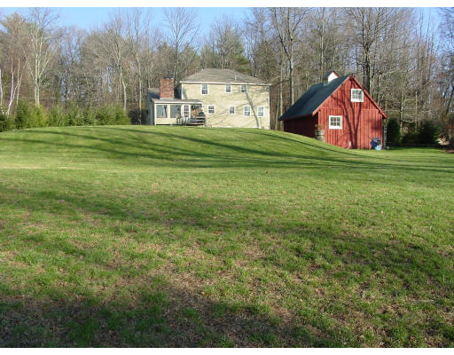 49 Barton Road Stow, MA 01775 - Photo 2 of 10 a house view with a garden space