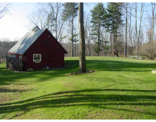 49 Barton Road Stow, MA 01775 - Photo 4 of 10 a view of a tiny house with a yard