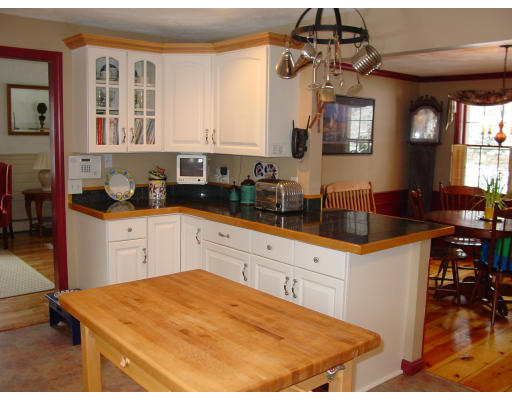 49 Barton Road Stow, MA 01775 - Photo 5 of 10 a kitchen with a sink a stove and cabinets