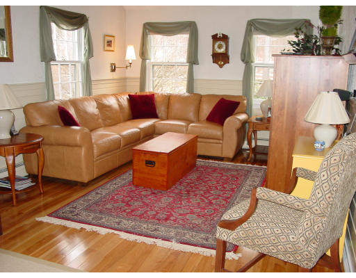 49 Barton Road Stow, MA 01775 - Photo 7 of 10 a living room with furniture and a rug