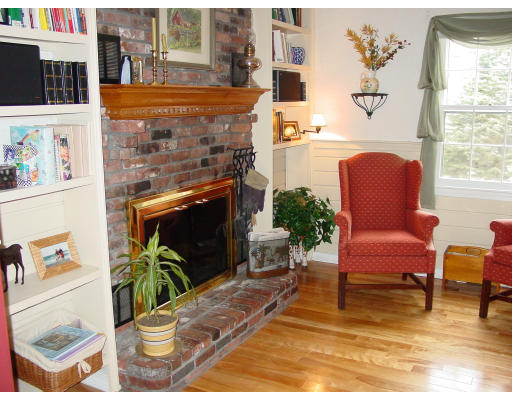 49 Barton Road Stow, MA 01775 - Photo 8 of 10 a room with furniture and a potted plant