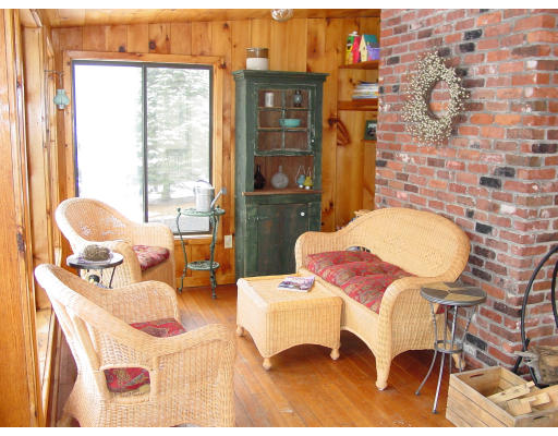 49 Barton Road Stow, MA 01775 - Photo 9 of 10 a living room with patio furniture and a floor to ceiling window