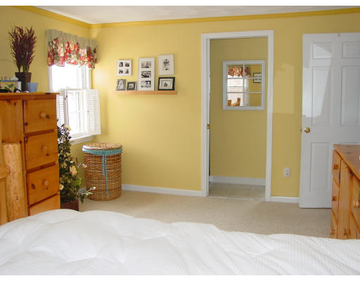 49 Barton Road Stow, MA 01775 - Photo 10 of 10 a bedroom with a bed and wooden floor