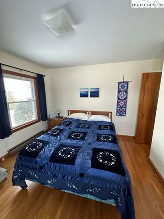 a room with lots of chairs and a fan