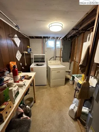 a bathroom with a sink a toilet a mirror and shower