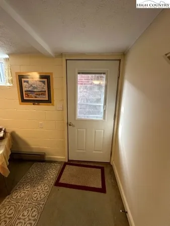 a large bathroom with a tub sink and mirror