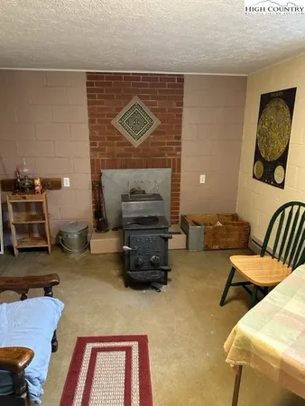a room with furniture and a painting on the wall