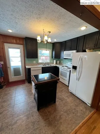 a view of a livingroom with furniture and a flat screen tv