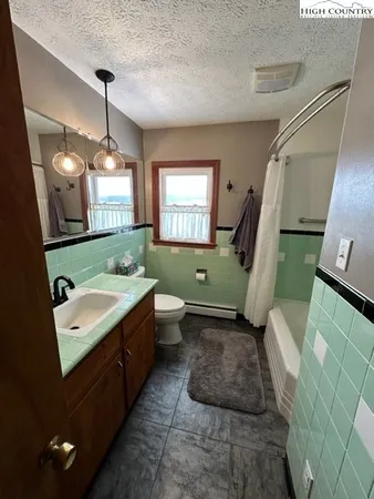 a bedroom with bed and window