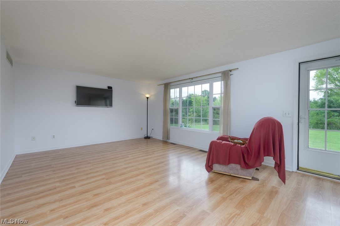 8045 State Rte 5 Ravenna, OH 44266 - Photo 15 of 32 Sitting room featuring a wealth of natural light and light hardwood floors