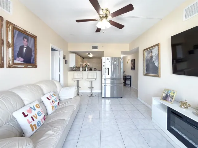 a living room with furniture and flat screen tv