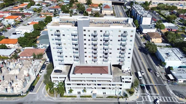 an aerial view of a multi story parking building