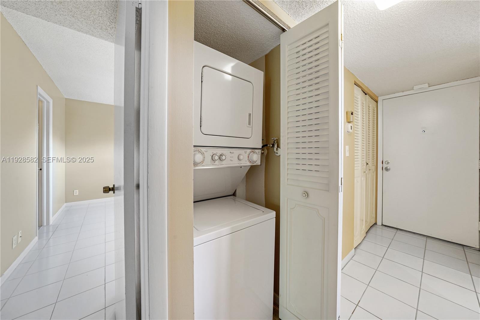 8305 Northwest 61st Street, Unit C305 Tamarac, FL 33321 - Photo 17 of 24 a view of bathroom with a sink and a mirror