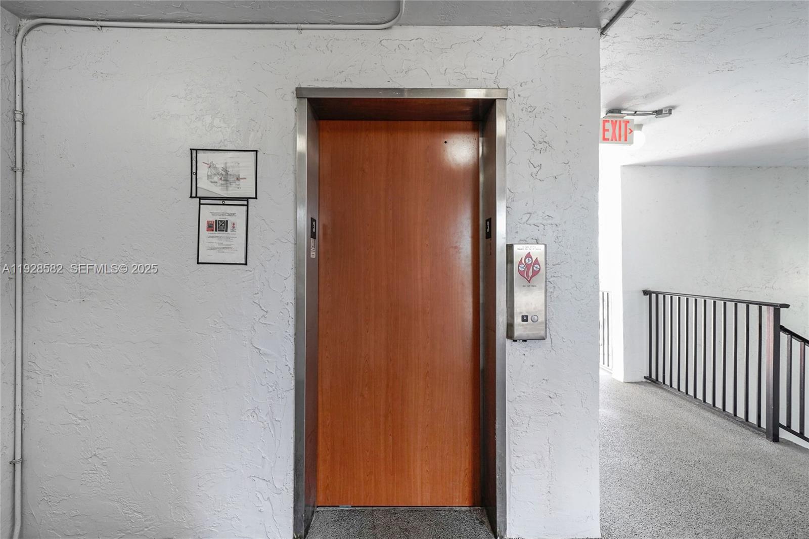 8305 Northwest 61st Street, Unit C305 Tamarac, FL 33321 - Photo 19 of 24 a view of a hallway with wooden floor