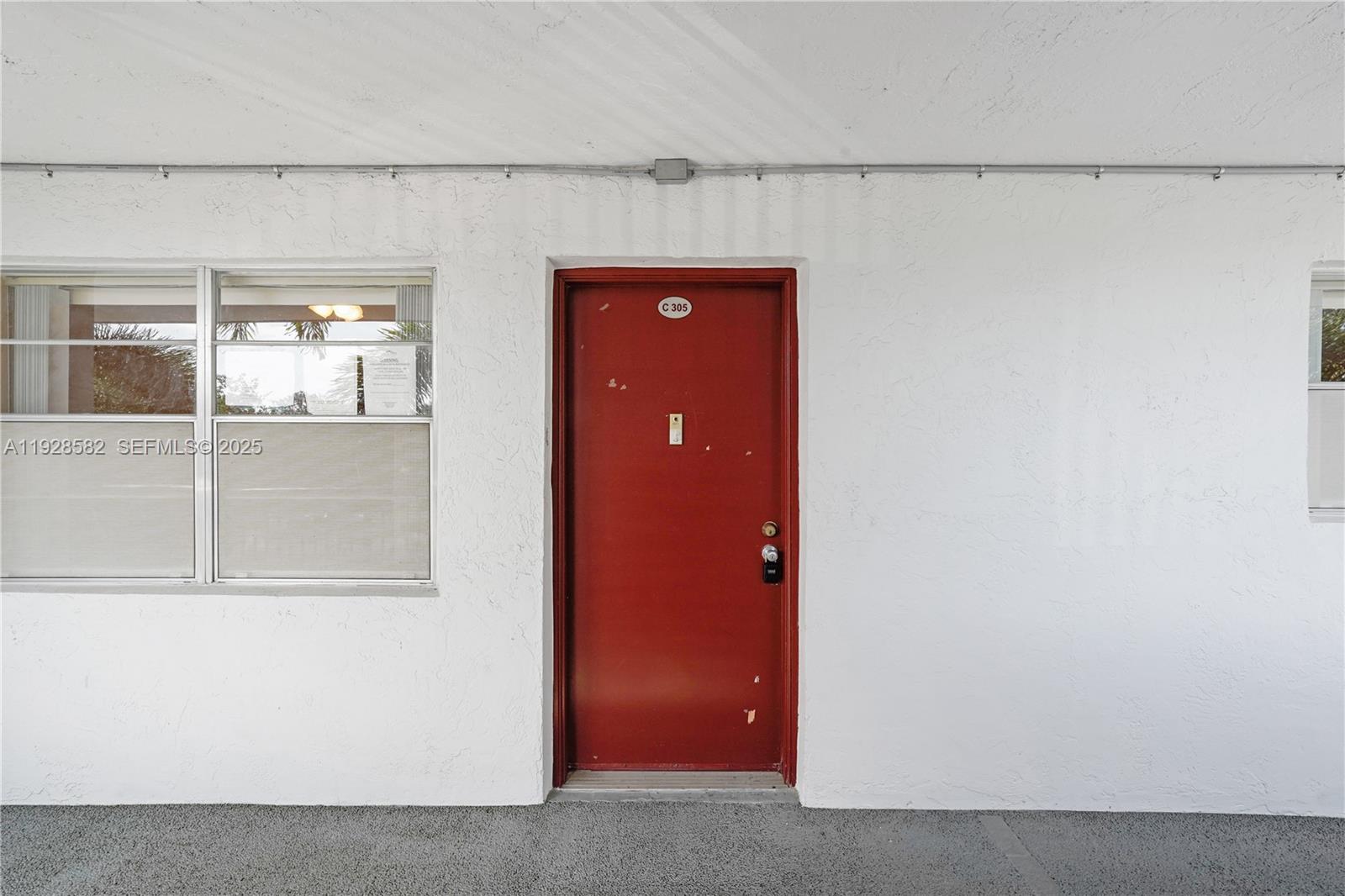 8305 Northwest 61st Street, Unit C305 Tamarac, FL 33321 - Photo 2 of 24 a view of front door