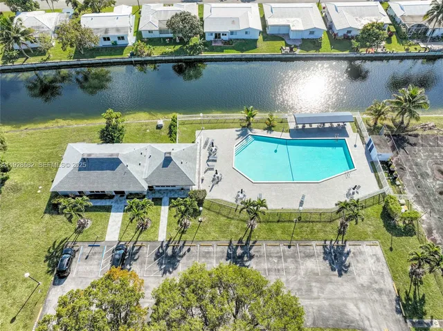 an aerial view of a house with a lake view