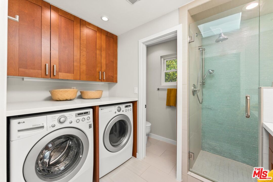 8326 Ridpath Drive Los Angeles, CA 90046 - Photo 12 of 25 a utility room with dryer and washer