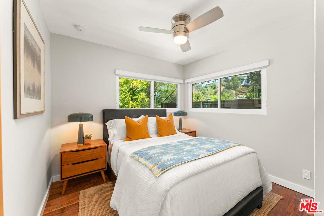 8326 Ridpath Drive Los Angeles, CA 90046 - Photo 13 of 25 a bedroom with a bed and a window