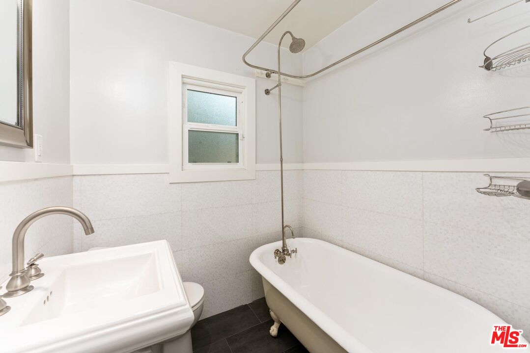 8326 Ridpath Drive Los Angeles, CA 90046 - Photo 14 of 25 a bathroom with a sink a toilet and shower