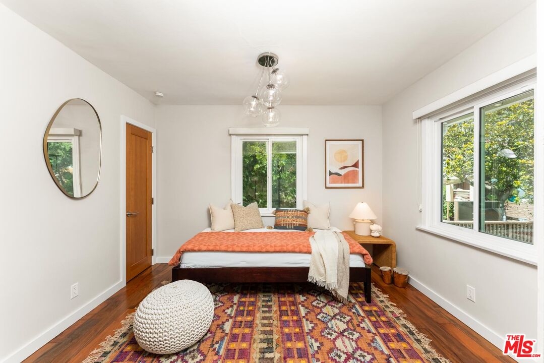 8326 Ridpath Drive Los Angeles, CA 90046 - Photo 15 of 25 a bedroom with bed and a window