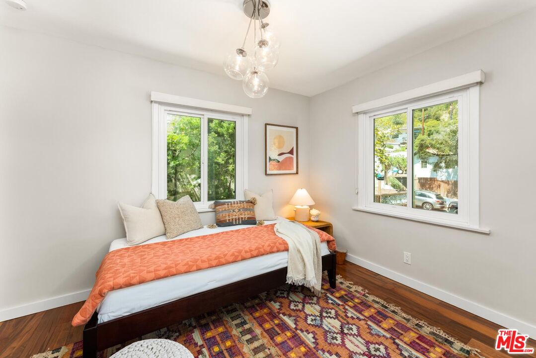 8326 Ridpath Drive Los Angeles, CA 90046 - Photo 16 of 25 a bedroom with a bed and a window