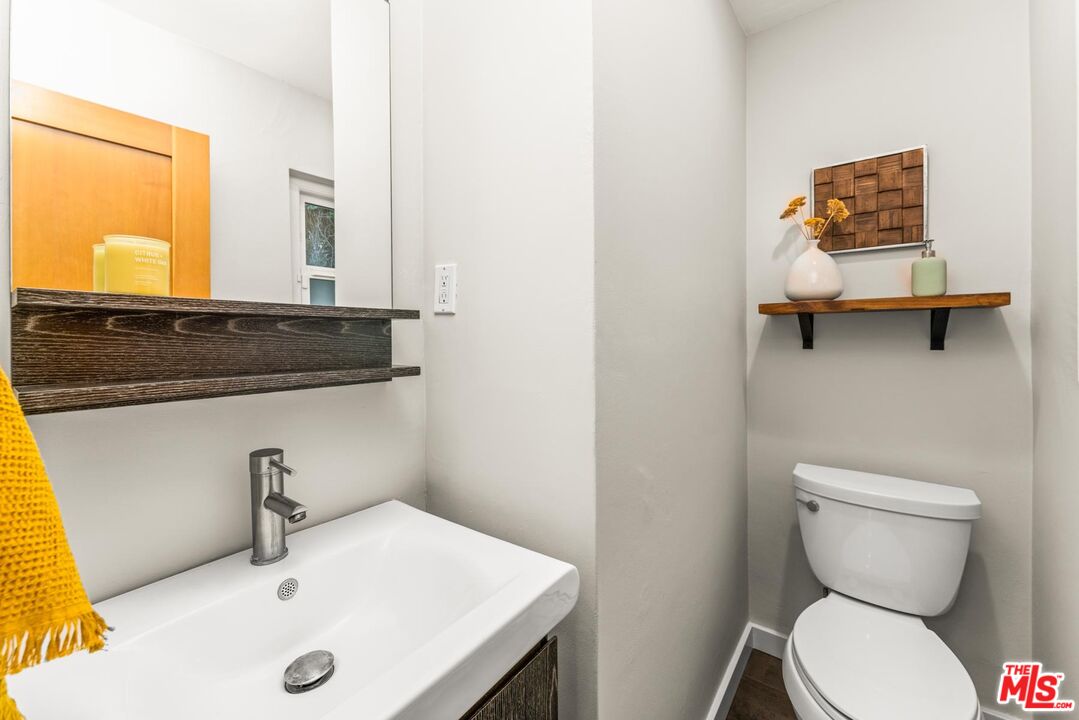 8326 Ridpath Drive Los Angeles, CA 90046 - Photo 17 of 25 a bathroom with a sink and a toilet